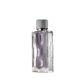 Abercrombie & Fitch First Instinct bottle front view shows water-like glass for everyday confidence.