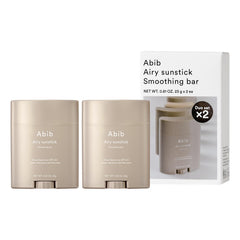 Abib Airy Sunstick SPF50 compact in hand for on-the-go protection.