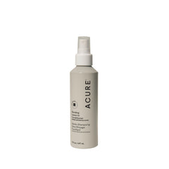 Acure Bonding Leave-In Conditioner bottle pour illustrating lightweight hydration and protection.
