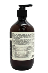 Aesop Cedarwood oil detail highlights cleansing properties for scalp balance.