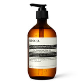 Aesop Resurrection Aromatique Hand Wash bottle on a sink offering gentle cleansing.