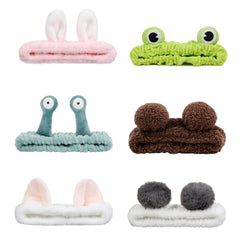 AIBFRID green frog headband keeps hair away for a clean skincare routine.