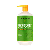 Alaffia EveryDay Coconut Body Lotion bottle on bathroom shelf for daily hydration.