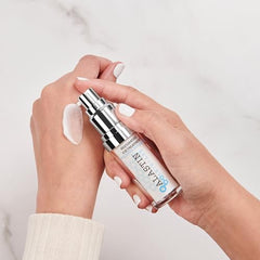 Close-up of ALASTIN Restorative Skin Complex texture reveals creamy serum for smooth, hydrated skin.