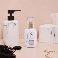 ALFAPARF MILANO Diamond leave-in being brushed through hair for smoothness