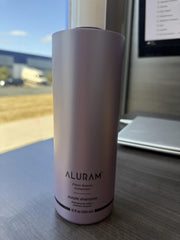 ALURAM Coconut Water Purple Shampoo lather on hand reveals rich hydration and detangling potential.