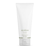 ALURAM Coconut Water Smoothing Cream bottle—frizz control and shine for silky, manageable hair.