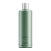 ALURAM Curl Shampoo bottle pour shows a hydrating cleanse for curls.