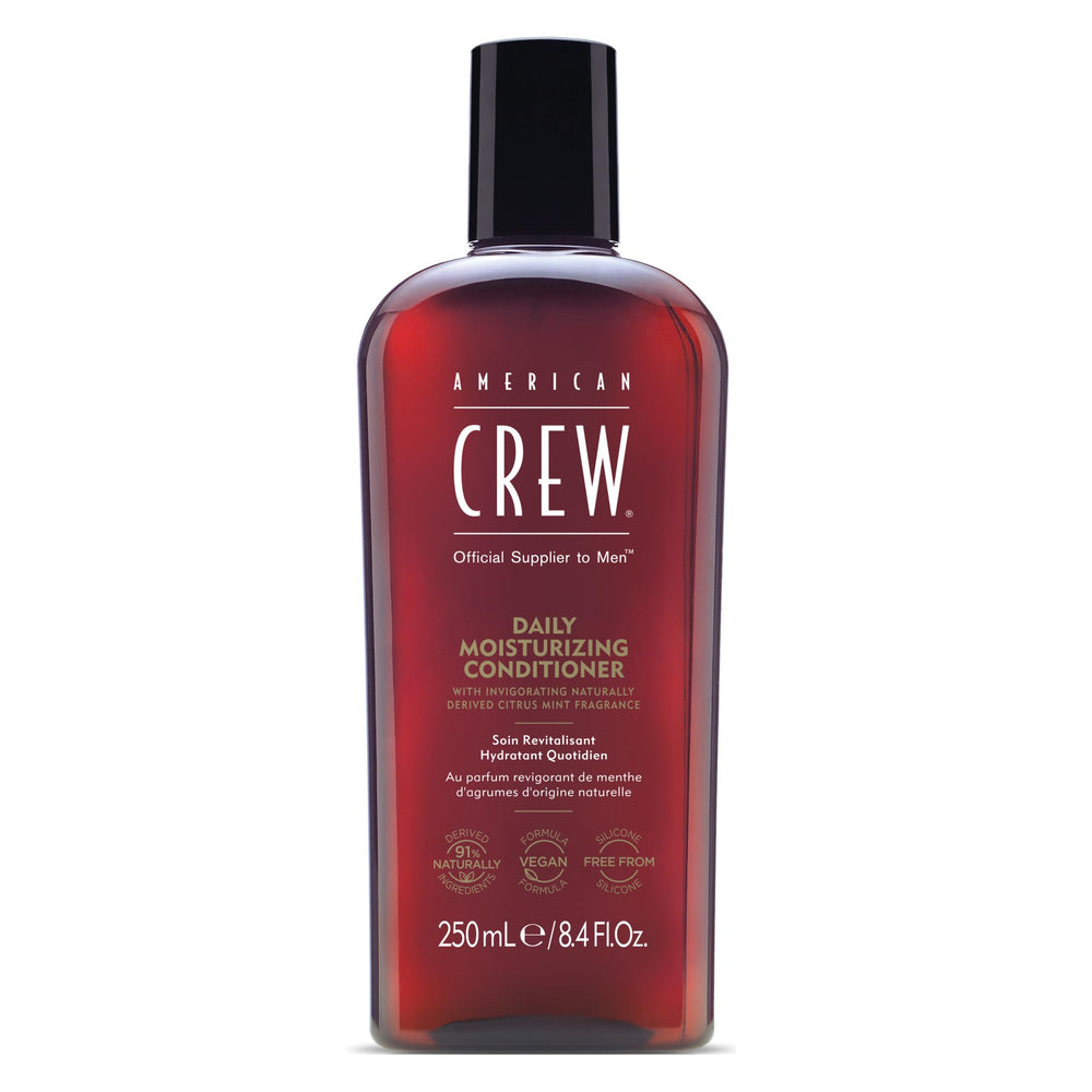 American Crew conditioner bottle pour with Citrus Mint fragrance for daily hydration.