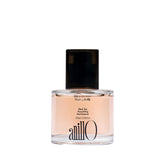 ANILLO Black Tea Nourishing Hair Essence bottle promises lightweight nourishment and silky shine.