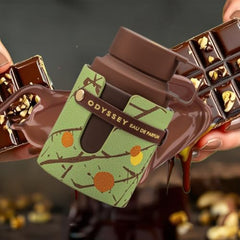 Armaf Odyssey Dubai Chocolat spray mist captured mid-air for a lasting impression.
