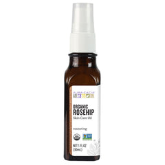 Aura Cacia Rosehip Oil bottle pour for daily facial hydration.