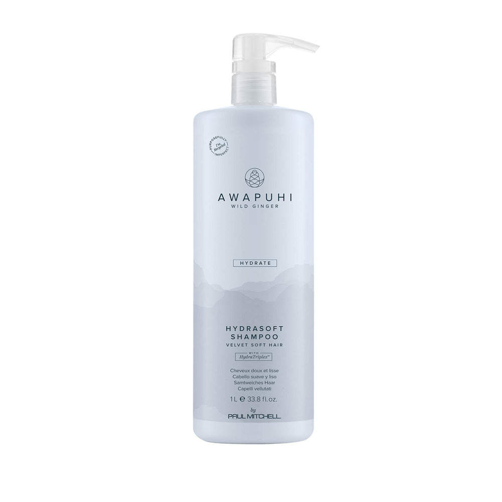 Awapuhi Wild Ginger HydraSoft Shampoo bottle on bathroom shelf delivering moisture and shine daily care.