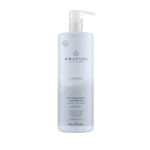 Awapuhi Wild Ginger HydraSoft Shampoo bottle on bathroom shelf delivering moisture and shine daily care.