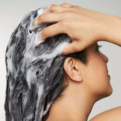 Awapuhi Wild Ginger Nourishing Shampoo keratriplex image emphasizes reinforced strand strength.