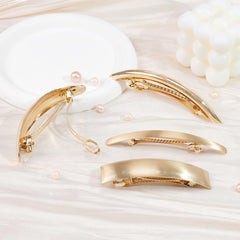 Ayesha flat-metal hair clip in pony style secures sleek ponytails with comfortable all-day hold.