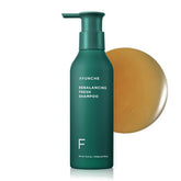 AYUNCHE Rebalancing Shampoo bottle closeup balances an oily scalp.