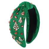 Babycop Christmas headband with green knotted rhinestones adds festive sparkle to your look.