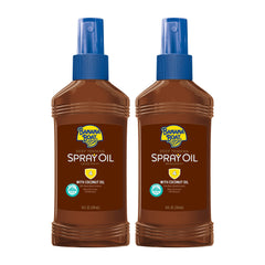 Banana Boat Deep Tanning Oil spray bottle, convenient SPF 4 sun protection during outdoor tanning.