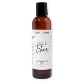 BASK & LATHER Elixir bottle close-up showing nutrient-rich formula for stronger, shinier hair.
