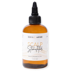 Bask & Lather scalp stimulator bottle pour showing targeted scalp care and fullness possibility.