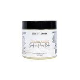 Bask & Lather scalp balm bottle shows mango and peppermint for refreshing moisture.