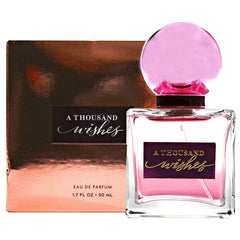 Bath and Body Works A Thousand Wishes EDP bottle with pyramid shape and bow, ideal for gifting and celebrations.
