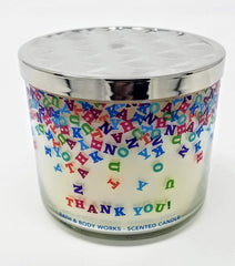 Bath & Body Works Champagne Toast candle jar artwork showcases seasonal color variations
