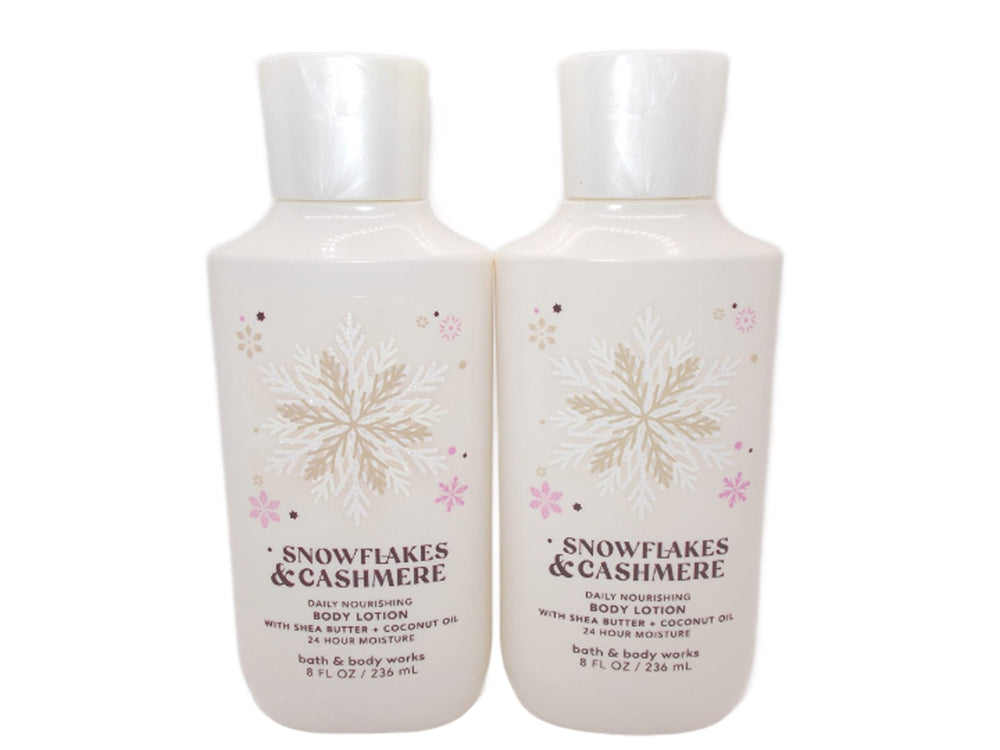 Bath & Body Works Snowflakes & Cashmere 8oz bottle pouring for lasting moisture.