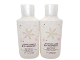Bath & Body Works Snowflakes & Cashmere 8oz bottle pouring for lasting moisture.