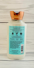 Bath and Body Works Wrapped in Sugar Soft Marshmallow lotion bottle highlighting creamy texture and nourished skin.