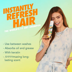 Batiste Tropical Dry Shampoo spray application for quick refresh and texture