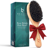 Beauty by Earth boar bristle brush closeup demonstrates gentle detangling and frizz control.
