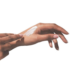 Beekman 1802 hand cream applied on skin for a smooth finish.