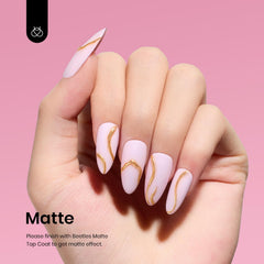 Beetles Gel Polish pink on nail close-up with glossy finish