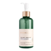 BIOSSANCE Squalane + Amino Aloe Gentle Cleanser pump showing hydrating makeup removal in action.