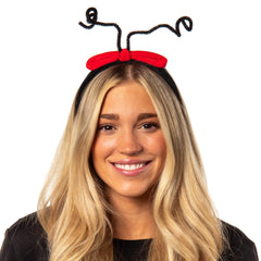 Bioworld Cindy Lou Who headband worn on a model for festive Grinch-themed look
