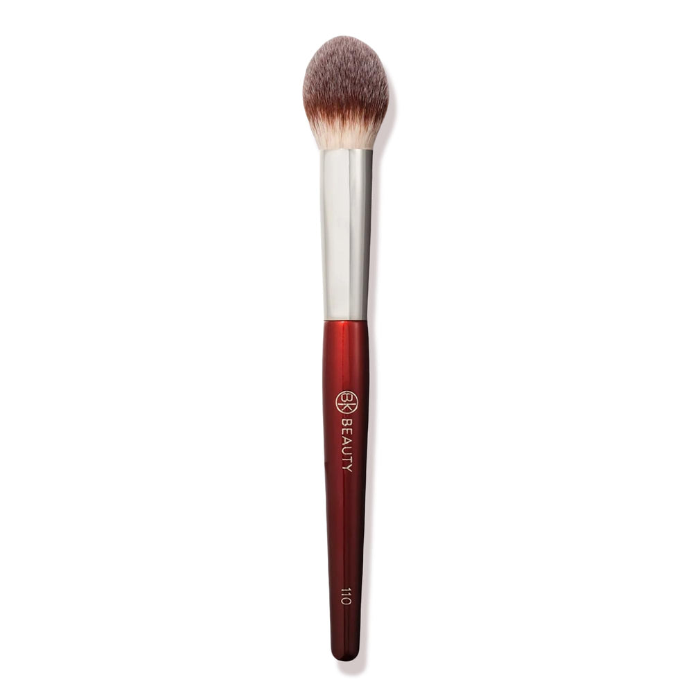 BK BEAUTY 110 large concealer brush closeup showing dense tapered bristles for swift under-eye blending.
