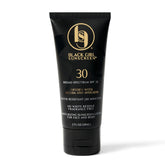 Black Girl Sunscreen front bottle showing compact travel size and protection