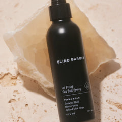 Blind Barber damp-hair application shows spray from roots to ends