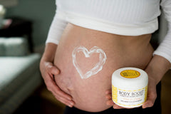 Body Boost Milk & Honey Butter texture shot highlights rich, creamy consistency for gentle massaging.