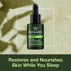 Botanics Restoring Overnight Face Oil drops on palm illustrating quick absorption
