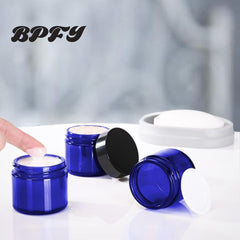 BPFY 2oz blue glass jar inner liner improves leak prevention for creams.