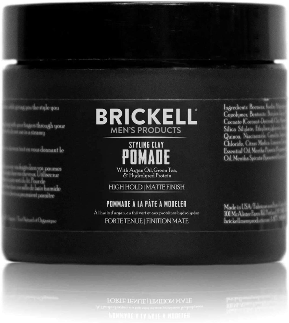 Brickell Men's Hair Styling Clay Pomade bottle closeup showing natural hold for all hair types