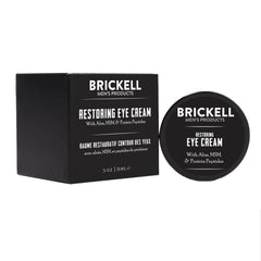 Brickell Men's Restoring Under Eye Cream packaging on shelf emphasizing unscented formula.