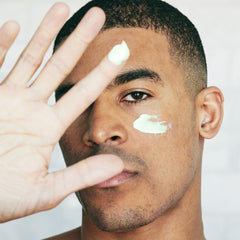 Brickell Men's Retinol Face Moisturizer during night routine showing smooth finish.