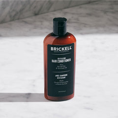Brickell Men's Revitalizing Hair Conditioner label highlights organic ingredients for color-treated hair.