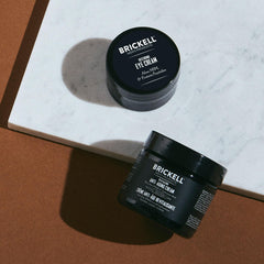 Brickell Men's Ultimate Eye Cream tube close-up reduces puffiness and dark circles