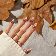 BTArtbox Almond nails short length on finger close-up for quick glam.