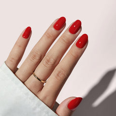 BTArtbox press-on nails short red oval closeup with salon-like gel finish.